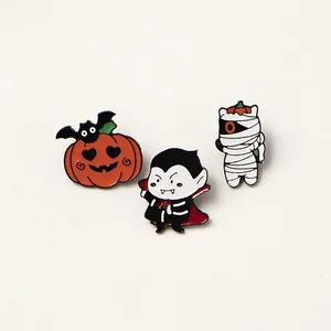 Set of 3 Halloween enamel pins featuring cute pumpkin mummy and vampire motifs