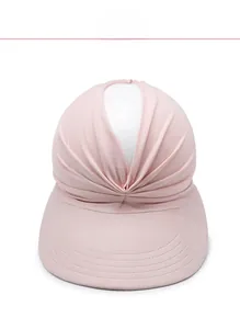 Detailed view of pink pleated sun hat with elastic knit fabric and wide protective brim