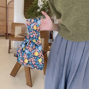 Floral cotton wrist bag featuring pink flowers and lemons on dark blue fabric