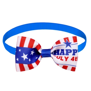 Close-up of July 4th pet bow tie with US flag pattern and Happy July 4th text print