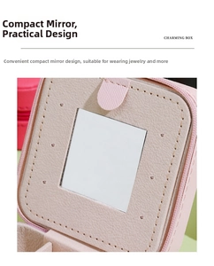 Detail of pink PU leather jewelry box featuring a built-in square mirror and fine stitching