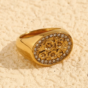 Detailed view of vintage 18K gold plated flower ring with white zircon stones