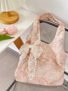 Chic pink floral lace handbag with bow embroidery and a large decorative lace ribbon