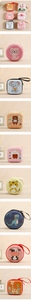 Detail of colorful cartoon animal hard shell coin purses with secure zipper and lanyards