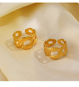 Close-up of adjustable 18K gold plated chain rings with smooth and frosted textures on satin