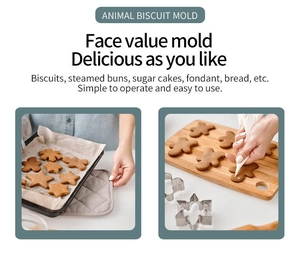 Detailed scene of using stainless steel animal biscuit molds to cut dough for cookies