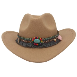 Detail of camel wool felt cowboy hat with ethnic beaded band and grey tassel trim