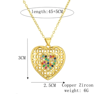 Detail view of gold heart necklace with zircon inlay and product size specifications