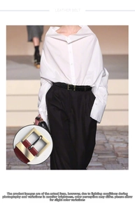 Detail showing hand-woven black leather belt with square metal buckle on trousers