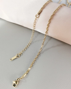 Detail of gold stainless steel twisted chain necklace with S.Steel hallmark tag
