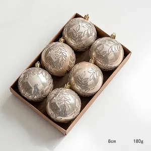 Lot de 6 boules de Noël 8cm or champagne avec motifs pailletés dans une boîte kraft