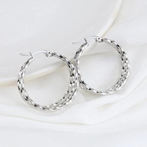 Fashionable silver stainless steel hoop earrings with a twisted rope design and secure clasp