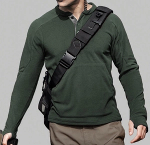 Detail of dark green tactical fleece pullover featuring button collar and thumbhole cuffs