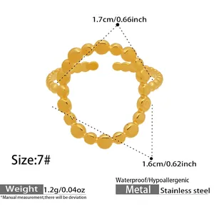 Detail view of a gold beaded open stainless steel ring with size and weight specs