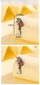 Detailed view of Gothic black dragon wing stud earring with red heart zircon and measurements