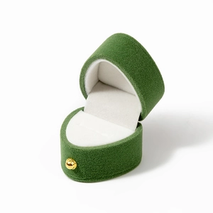 Premium heart-shaped velvet ring box in dark green with golden clasp and white lining