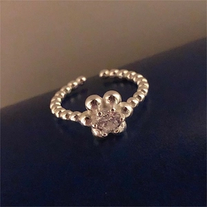 Adjustable silver floral ring featuring a bubble band and a sparkling zircon center stone