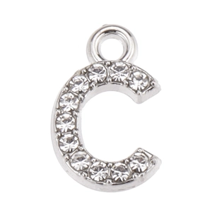Macro detail of silver alloy letter C pendant with micro-pave white rhinestones