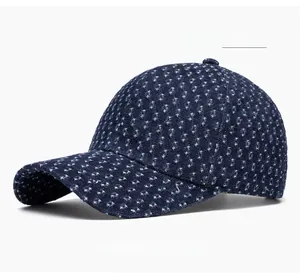 Detail of deep blue denim baseball cap with small white star patterns and top button