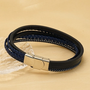 Close-up of multilayer leather bracelet with blue woven ropes and silver metal clasp
