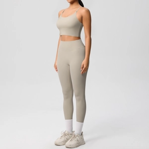 Detail of beige yoga set showing thin strap sports bra and high waist leggings fabric