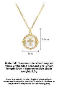 Detailed view of titanium steel cross necklace with crystal pavé and pearl accents