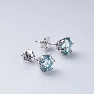 Close-up of S925 sterling silver earrings with blue moissanite in classic 6-claw setting