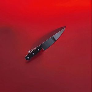 Creative chef knife hair clip with realistic black handle and metallic silver finish blade