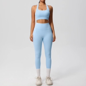 Detail of light blue high waist yoga leggings with functional side pockets and seam work