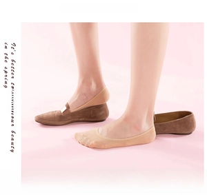 Invisible nude-colored lace socks shown inside brown suede loafers for women