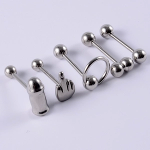 Detailed view of silver stainless steel tongue rings in various shapes on white background