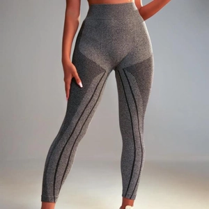 High-waisted seamless knitted yoga leggings with breathable mesh textures in dark grey