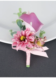 Macro detail of handmade calla lily boutonniere with lavender petals and pink silk ribbon