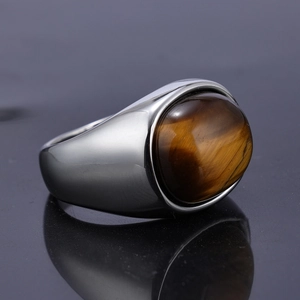 Men's stainless steel ring featuring an oval tiger eye stone with a polished silver band