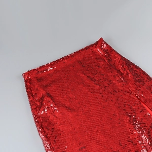 Close-up of high-density red sequins fabric on a lapel top and split skirt set