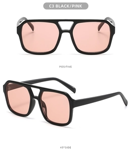 Detail view of double bridge aviator sunglasses with black frame and pink lenses