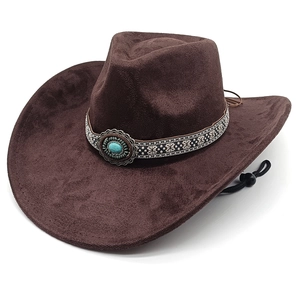 Detail of dark brown western cowboy hat with ethnic band and turquoise stone accent
