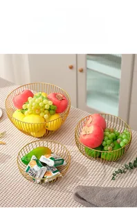 Set of three tiered gold iron wire fruit baskets with minimalist nordic hollow design