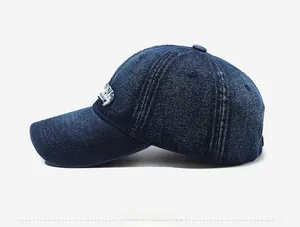 Detailed side view of dark blue denim baseball cap showing premium stitching and six-panel crown