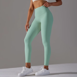 Detailed side view of high-waisted seamless yoga leggings in mint green with lift effect