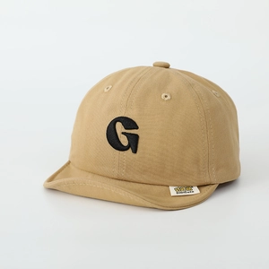 Detailed macro shot of the premium cotton fabric and G letter embroidery on the baby cap
