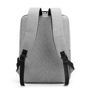 Professional grey USB charging travel backpack with adjustable straps on white background