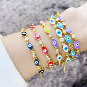 Bohemian gold evil eye bracelet set with multi-colored enamel and sparkling crystals