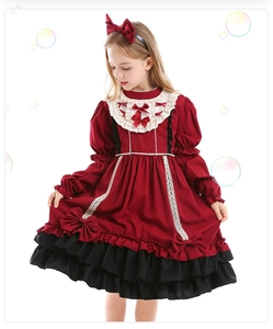 Close-up of red and black Spanish Lolita dress with lace details and layered ruffles