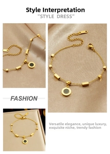 Detailed close-up of gold stainless steel bracelet with black Roman pendant and geometry