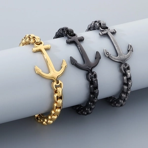 Men's anchor bracelets in gold, matte black and silver finishes on industrial chains