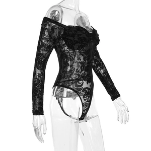 Detail view of black floral lace fabric on a long sleeve off-shoulder bodysuit top