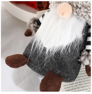 Close-up of Nordic grey gnome decor showing soft felt texture and white bushy beard