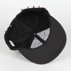 Detail of internal sweatband and adjustable snapback on black studded flat brim hip hop hat