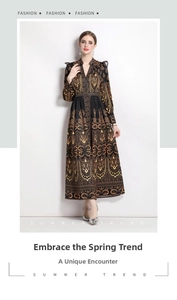 Detail of vintage paisley print and elastic cuffs on a black V-neck long-sleeved dress